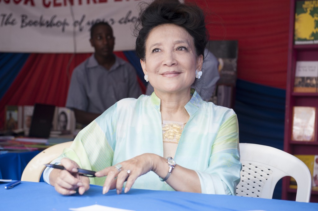 Author Jung Chan (:Wild Swans" signs copies of her books for visitors of the Storymoja Hayfestival 2012, Nairobi, Kenya.